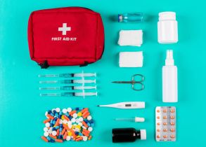 flat-lay-first-aid-kit-with-pills-thermometer-spray-pills-and-bandage-on-cyan-blue-background-horizontal (1)
